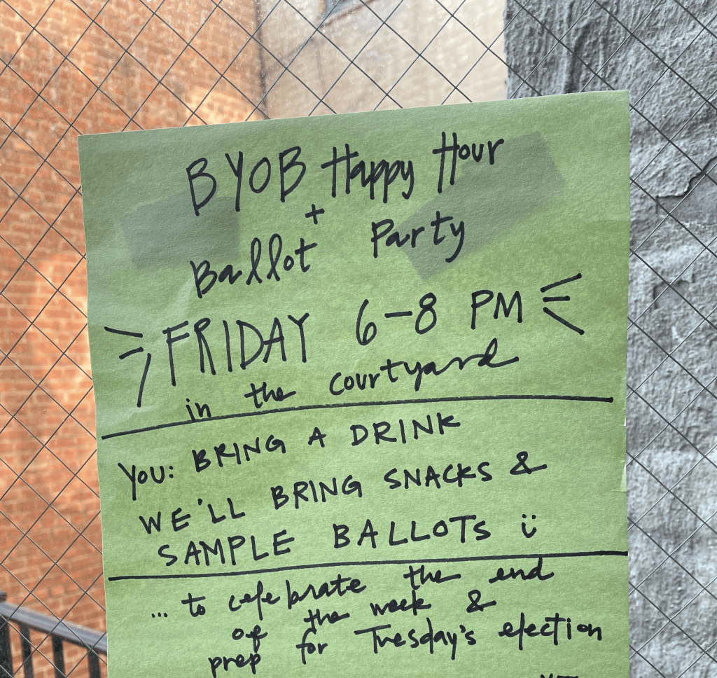 light green construction paper that reads "Ballot Party Friday 6–8 PM in the courtyard to celebrate the end of the week and prep for Tuesday's election" 